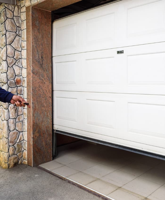 Electric Garage door starts to open as remote control is pressed