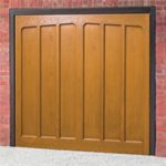 The Cardale Hambledon 2 fibreglass garage door with a lighter wood finish
