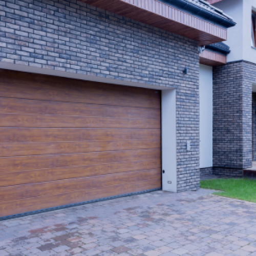 Brick house with wooden garage door